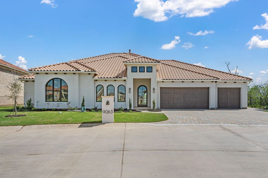 Front exterior of a new home in The Resort on Eagle Mt. Lake, Fort Worth, TX, highlighting curb appeal (Image 1). Front exterior of a new home in The Resort on Eagle Mt. Lake, Fort Worth, TX, highlighting curb appeal (Image 1).