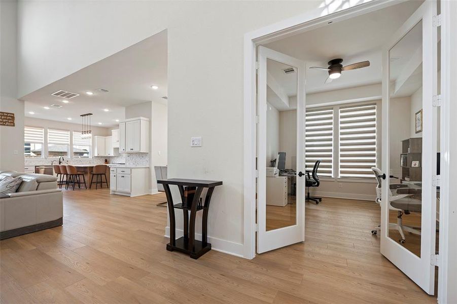 Work from home in a designated home office, accessed by glass French doors.