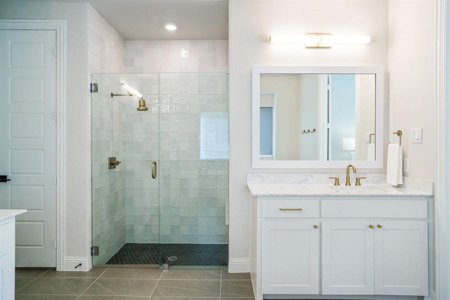 Sophisticated Simplicity - This frameless walk-in shower pairs large-scale tile with warm brass hardware, creating a look that’s both crisp and calming. Sophisticated Simplicity - This frameless walk-in shower pairs large-scale tile with warm brass hardware, creating a look that’s both crisp and calming.