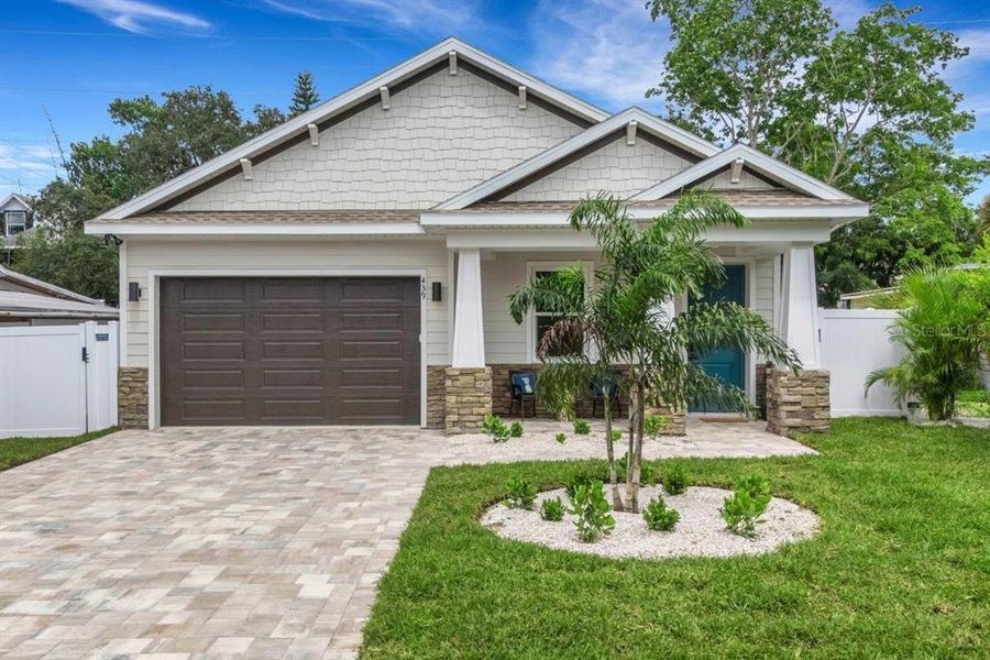 Front exterior of a new home in , Dunedin, FL, highlighting curb appeal (Image 2). Front exterior of a new home in , Dunedin, FL, highlighting curb appeal (Image 2).