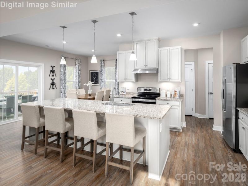Open and inviting — seating for four at the island makes this kitchen perfect for casual meals and conversation.
