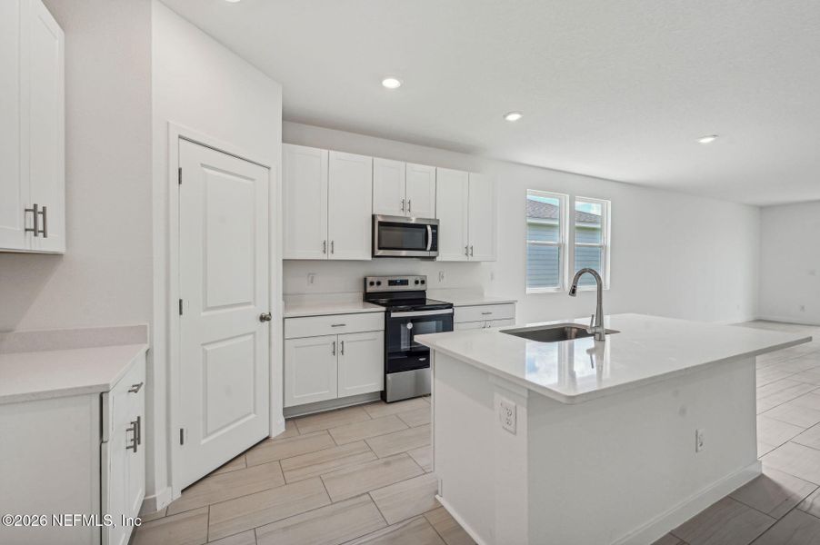 Furnished interior view inside a new home in Lakes at Bella Lago - Signature Series, Green Cove Springs (Image 8).