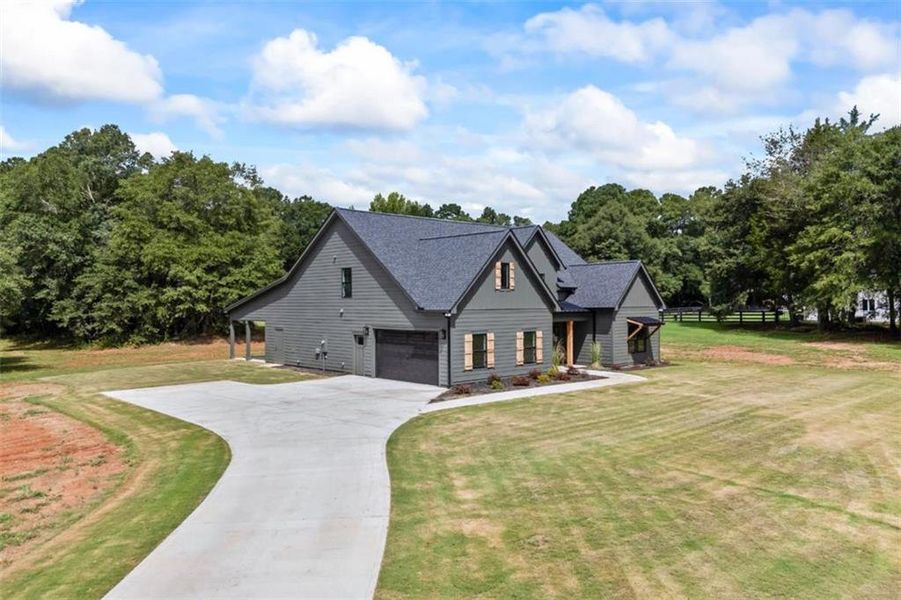 Front exterior of a new home in , Monroe, GA, highlighting curb appeal (Image 27).