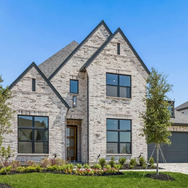 Front exterior of a new home in StarView, Prosper, TX, highlighting curb appeal (Image 26). Front exterior of a new home in StarView, Prosper, TX, highlighting curb appeal (Image 26).