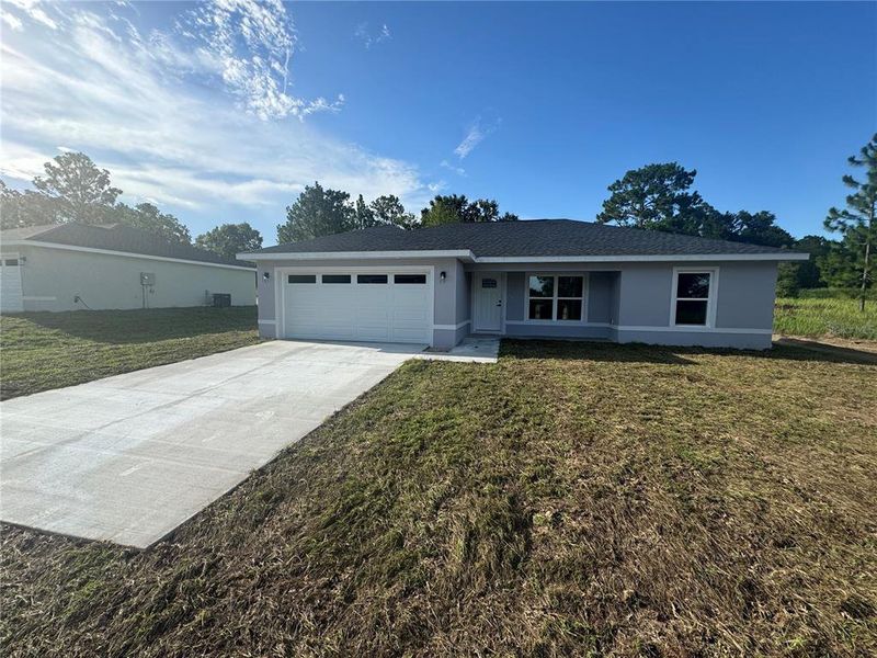 Front exterior of a new home in , Ocala, FL, highlighting curb appeal (Image 1). Front exterior of a new home in , Ocala, FL, highlighting curb appeal (Image 1).