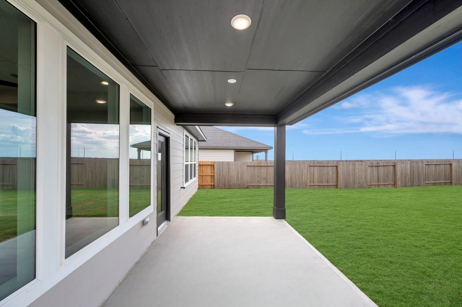 Exterior details and patio area of a home in Mason Woods, Cypress (Image 3).