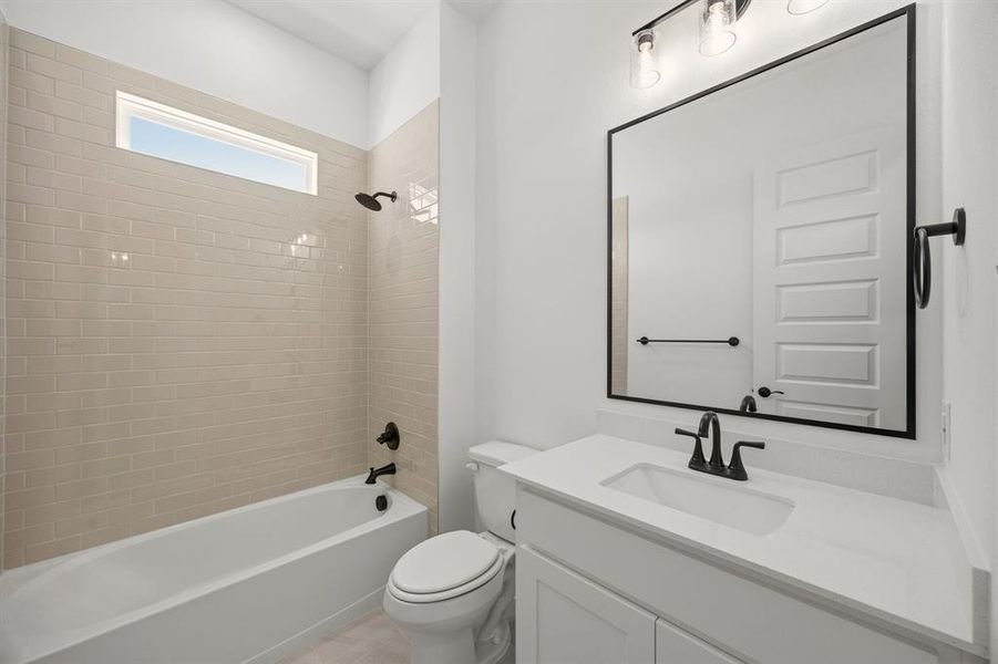 Full bath featuring vanity and shower / bath combination