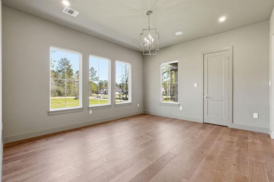 A refined formal dining room witha dramatic presence,thoughtfully staged to highlightscale and style.
