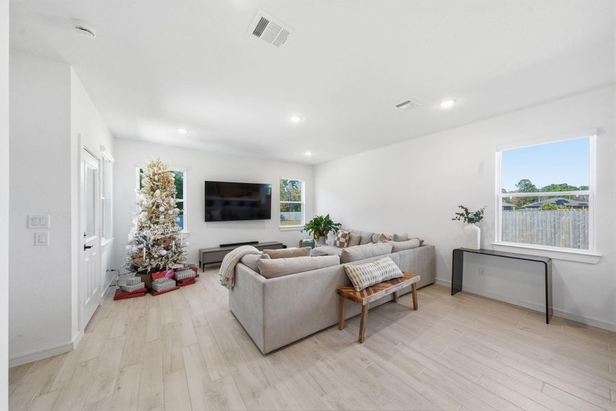 Bright, open living room  natural light from two windows.