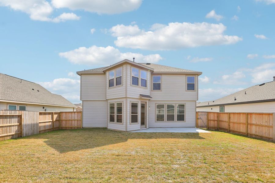 Come explore this generous backyard with patio slab—perfect for kids to play freely and adults to unwind in comfort!