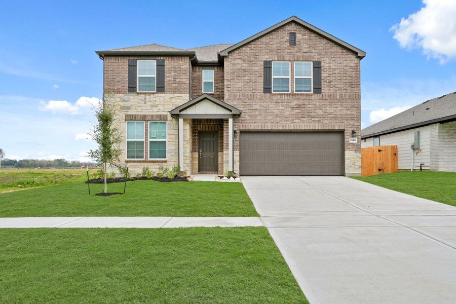 Front exterior of a new home in Valor Park, Bay City, TX, highlighting curb appeal (Image 17).