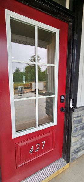An inviting entry door welcomes you home, boasting An inviting entry door welcomes you home, boasting