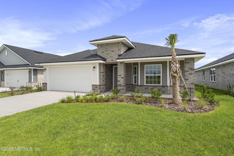 Front exterior of a new home in Shadow Crest at Rolling Hills, Green Cove Springs, FL, highlighting curb appeal (Image 17).