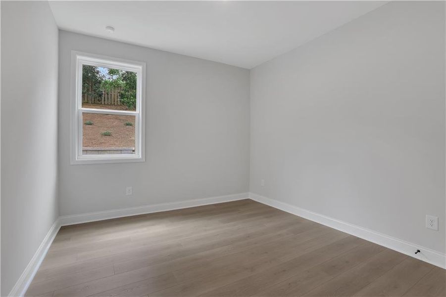 Spacious, unfurnished interior of a new home in The Paddocks at Doc Hughes, Buford (Image 33).