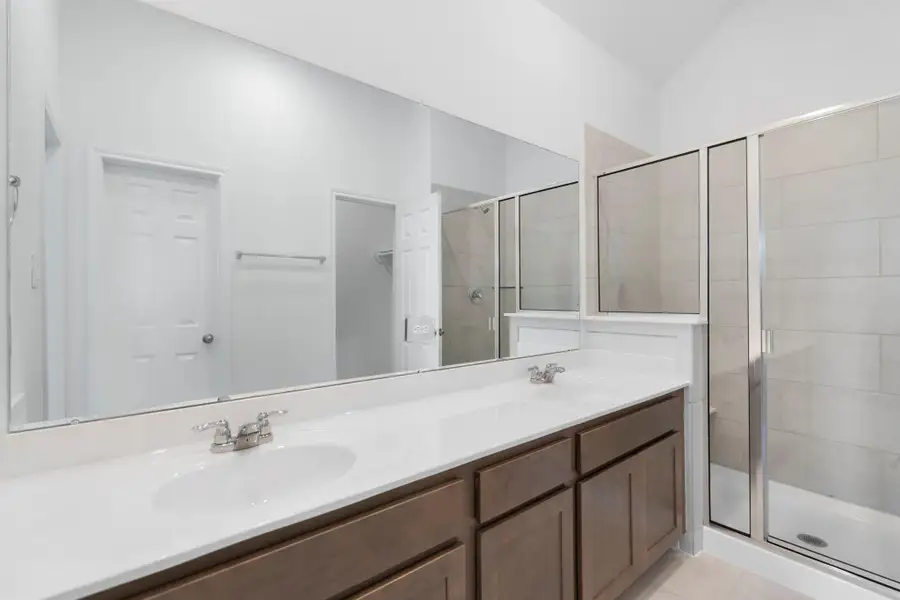 The en-suite bathroom offers a spa-like atmosphere with its elegant design, high end finishes, and tasteful lighting, creating a retreat within your own home. The en-suite bathroom offers a spa-like atmosphere with its elegant design, high end finishes, and tasteful lighting, creating a retreat within your own home.