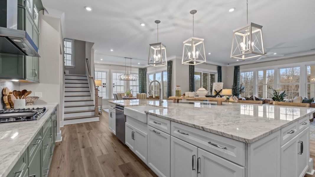 The Inspire Plan by DBR Homes kitchen with an oversized corner island modern cabinets and features in Fort Mill, SC.