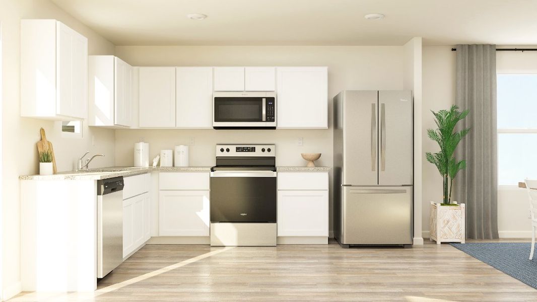 A kitchen with white cabinets. A kitchen with white cabinets.