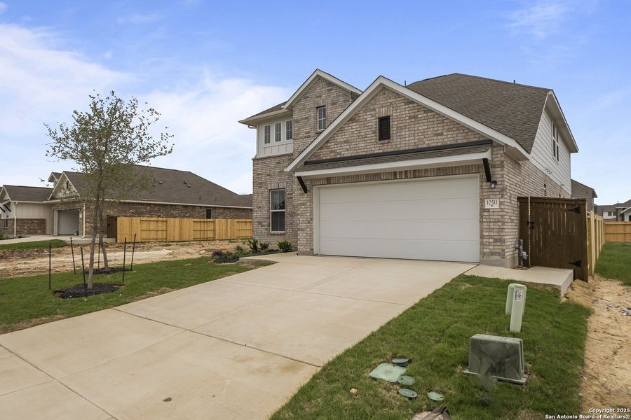 Front exterior of a new home in Stillwater Ranch, San Antonio, TX, highlighting curb appeal (Image 15).