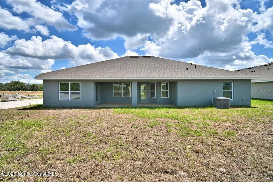 Exterior details and patio area of a home in Palm Bay, Palm Bay (Image 3).