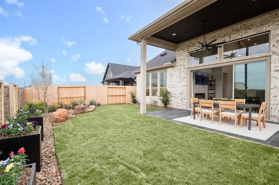 Exterior details and patio area of a home in Woodson’s Reserve 45′, Spring (Image 4).