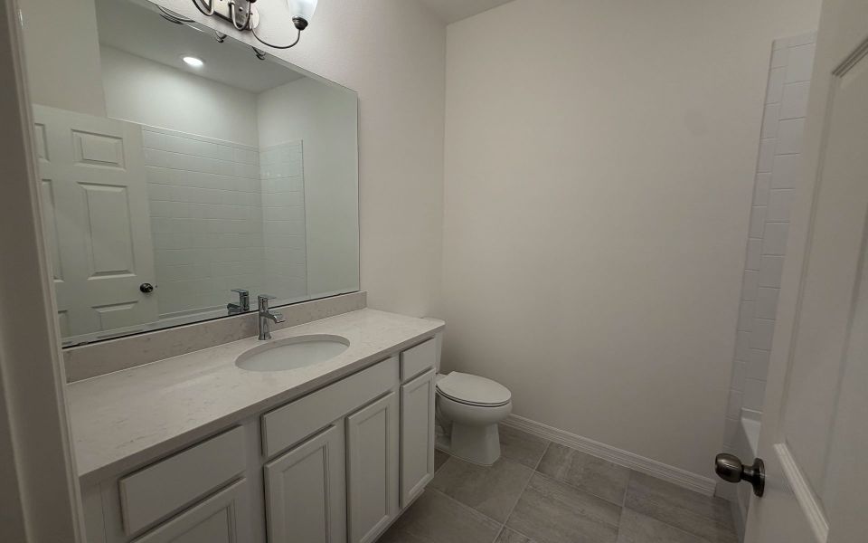 Furnished interior view inside a new home in Trinity Gardens, Deland (Image 9).