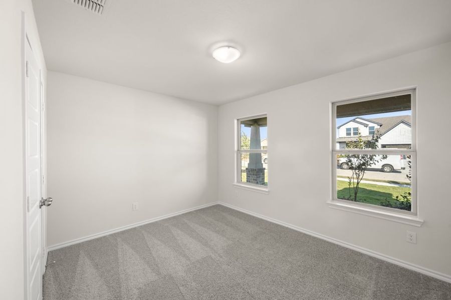 Front exterior of a new home in Myrtle Creek, Waxahachie, TX, highlighting curb appeal (Image 18). Front exterior of a new home in Myrtle Creek, Waxahachie, TX, highlighting curb appeal (Image 18).