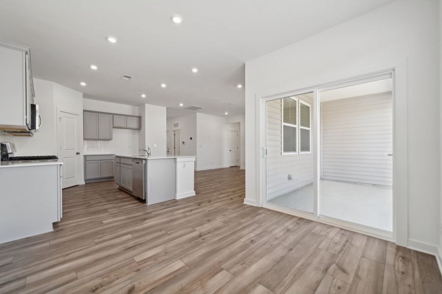 A large kitchen with white cabinets. A large kitchen with white cabinets.