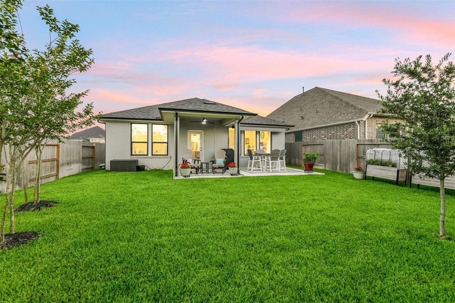 This open area of the yard would be perfect for a fire pit or play set!