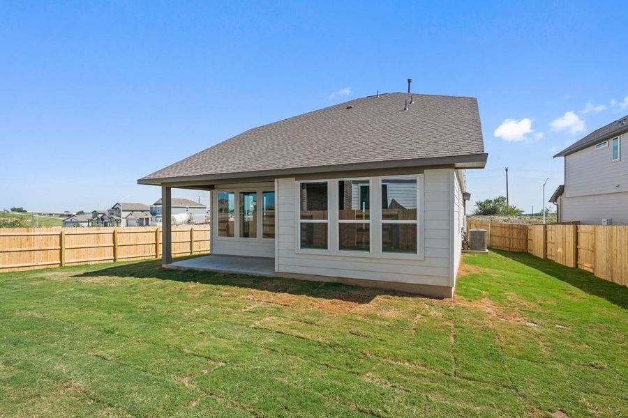 Exterior details and patio area of a home in Terrace Collection At Turner's Crossing, Buda (Image 3).