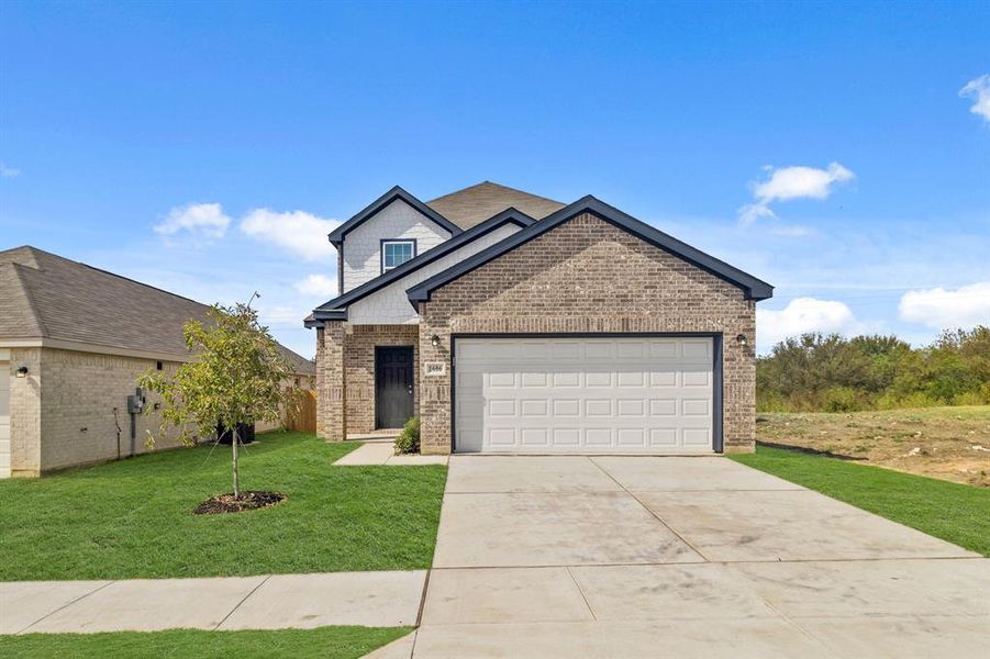 Front exterior of a new home in Christian Meadows, Ennis, TX, highlighting curb appeal (Image 1). Front exterior of a new home in Christian Meadows, Ennis, TX, highlighting curb appeal (Image 1).
