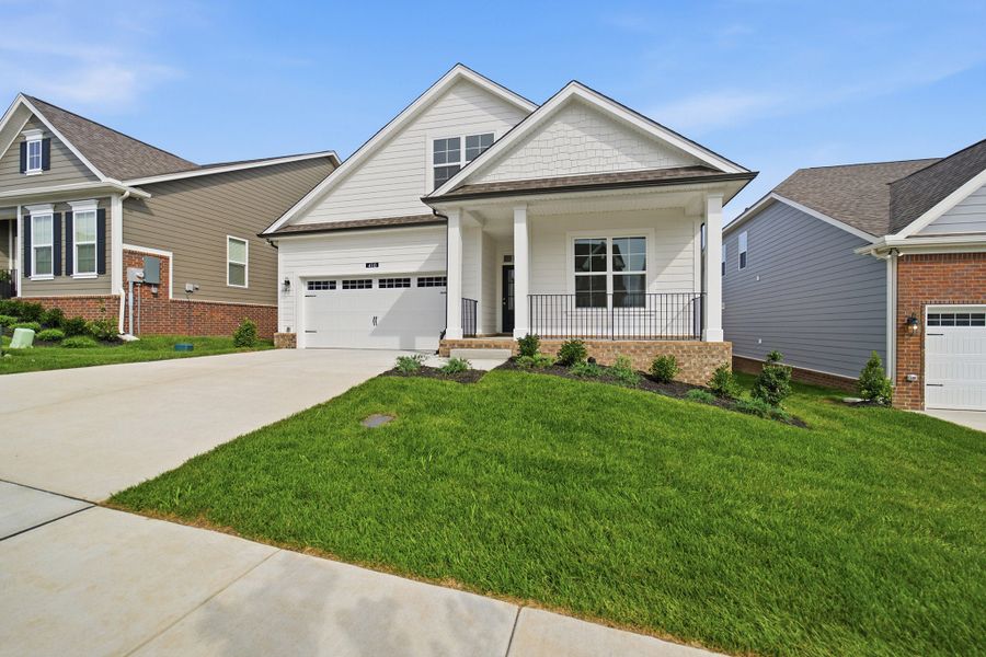 Front exterior of a new home in McCain's Station, Gallatin, TN, highlighting curb appeal (Image 2). Front exterior of a new home in McCain's Station, Gallatin, TN, highlighting curb appeal (Image 2).