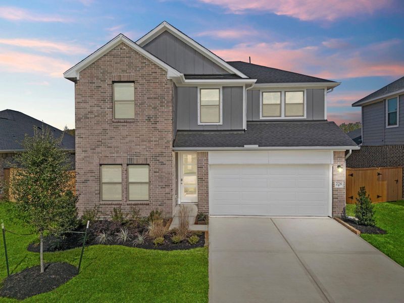 Front exterior of a new home in Laurel Landing, Alvin, TX, highlighting curb appeal (Image 21). Front exterior of a new home in Laurel Landing, Alvin, TX, highlighting curb appeal (Image 21).