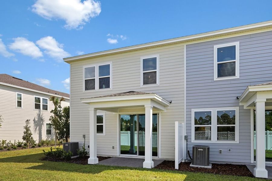 Exterior details and patio area of a home in Cherry Elm at SilverLeaf, St. Augustine (Image 2).