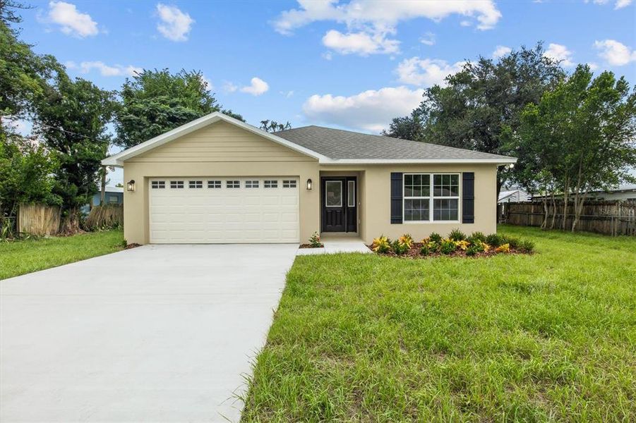 Front exterior of a new home in , Eagle Lake, FL, highlighting curb appeal (Image 15).