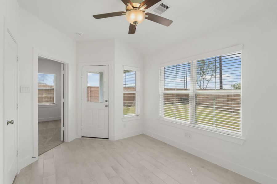 Representative unfurnished interior of a home built from the Chalet by Chesmar Homes in Meridiana Townhomes, Iowa Colony (Image 32).