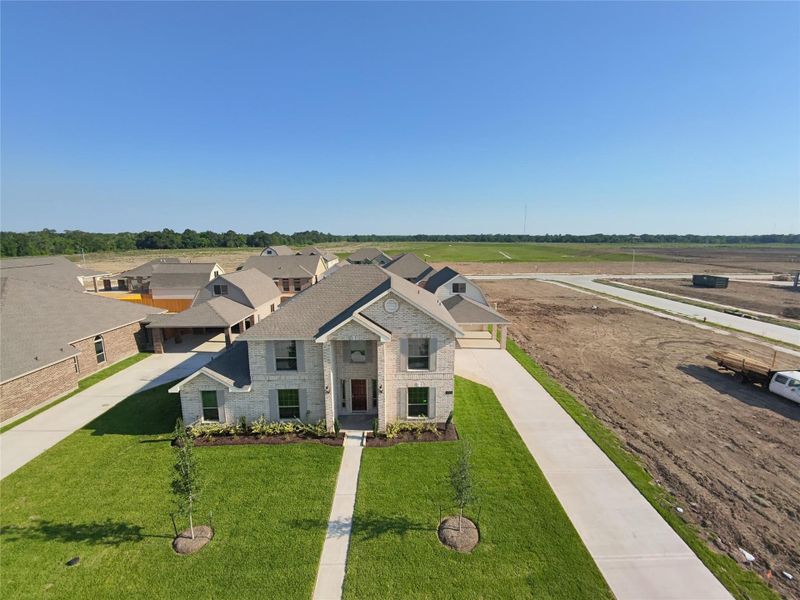 Front exterior of a new home in , League City, TX, highlighting curb appeal (Image 25).