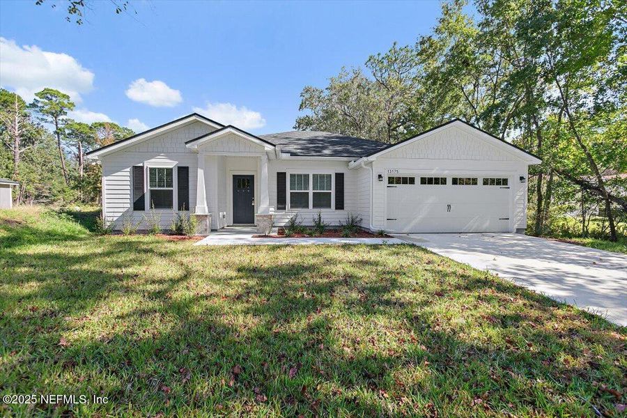 Front exterior of a new home in , Jacksonville, FL, highlighting curb appeal (Image 2).