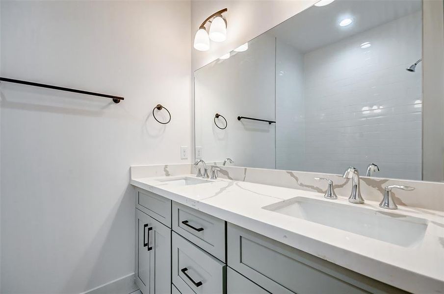 Secondary bathroom with two sinks