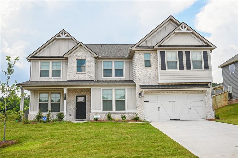 Front exterior of a new home in , Stockbridge, GA, highlighting curb appeal (Image 30).