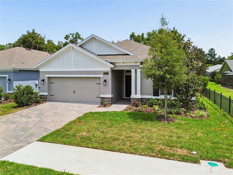 Front exterior of a new home in Cascades at Southern Hills, Brooksville, FL, highlighting curb appeal (Image 28).