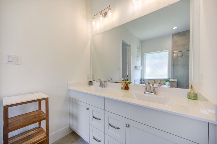 Clean lines and abundant storage create a fresh, welcoming primary bath. Clean lines and abundant storage create a fresh, welcoming primary bath.