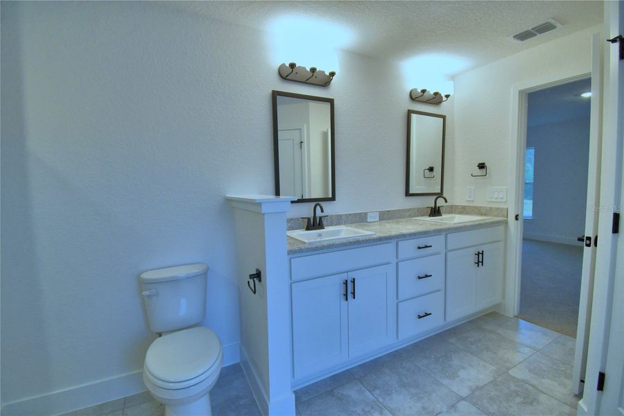 Furnished interior view inside a new home in Cadence Crossing, Auburndale (Image 13).