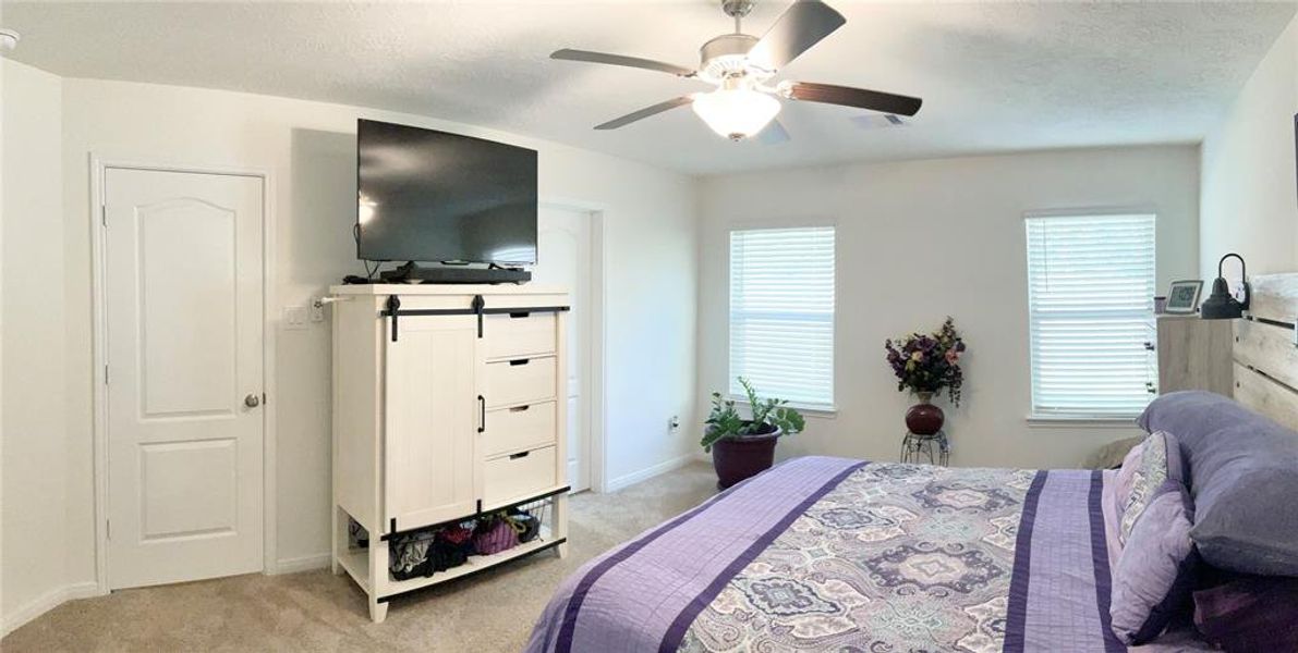 View of Primary Bedroom equipped with ceiling fan.