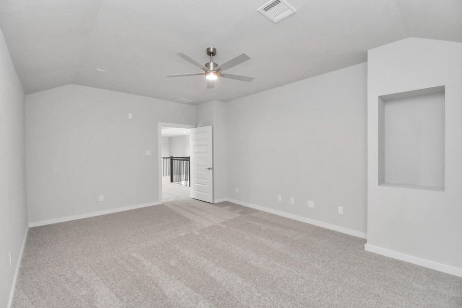 Generously sized secondary bedrooms featuring spacious closets, soft and inviting carpeting underfoot, large windows allowing plenty of natural light, and the added touch of privacy blinds for your personal retreat. Sample photo of completed home with similar floor plan. Actual colors and selections may vary.