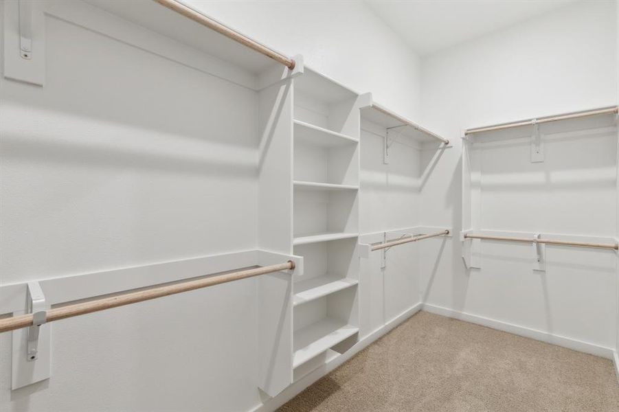 Primary closet in the Elm home plan by Trophy Signature Homes – REPRESENTATIVE PHOTO Primary closet in the Elm home plan by Trophy Signature Homes – REPRESENTATIVE PHOTO