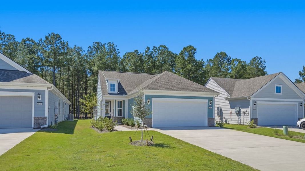 Front exterior of a new home in Sun City Hilton Head, Bluffton, SC, highlighting curb appeal (Image 21).