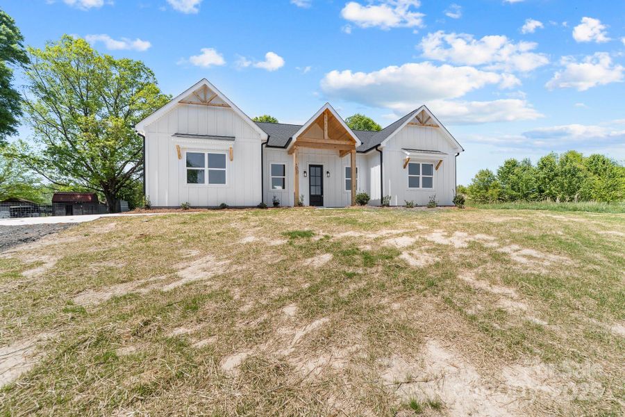 Front exterior of a new home in , Bessemer City, NC, highlighting curb appeal (Image 1).