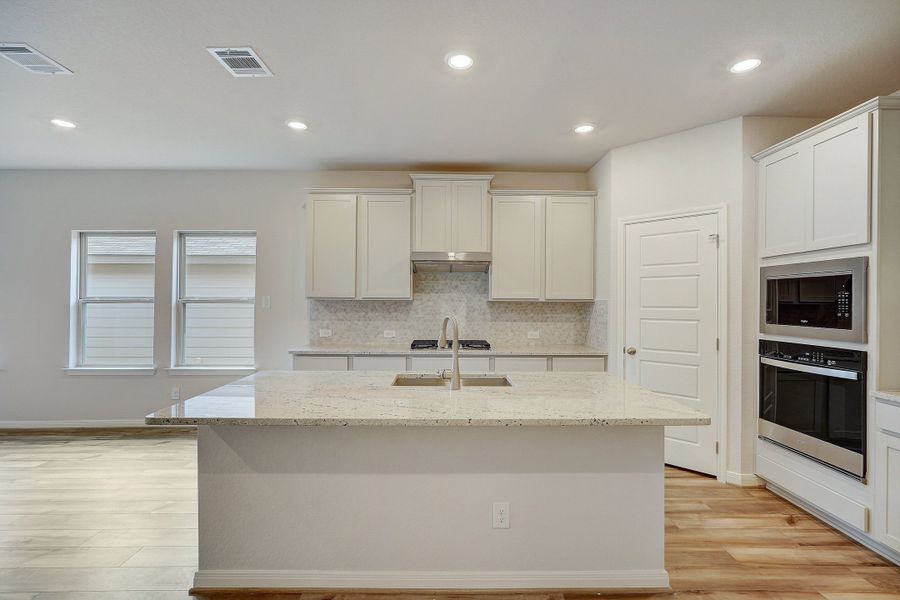 Kitchen in the Pearl floorplan at a Meritage Homes community.