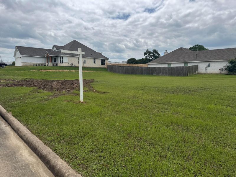 View of the corner homesite at 1707 Twin Oaks Circle, situated on a little over one-quarter acre in Timber Oaks.