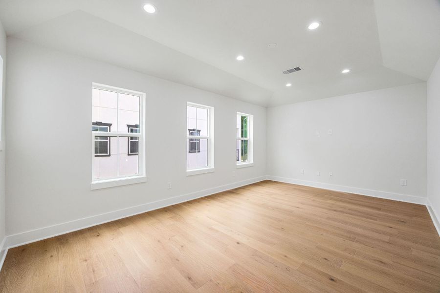 Primary bedroom with abundant natural light Primary bedroom with abundant natural light